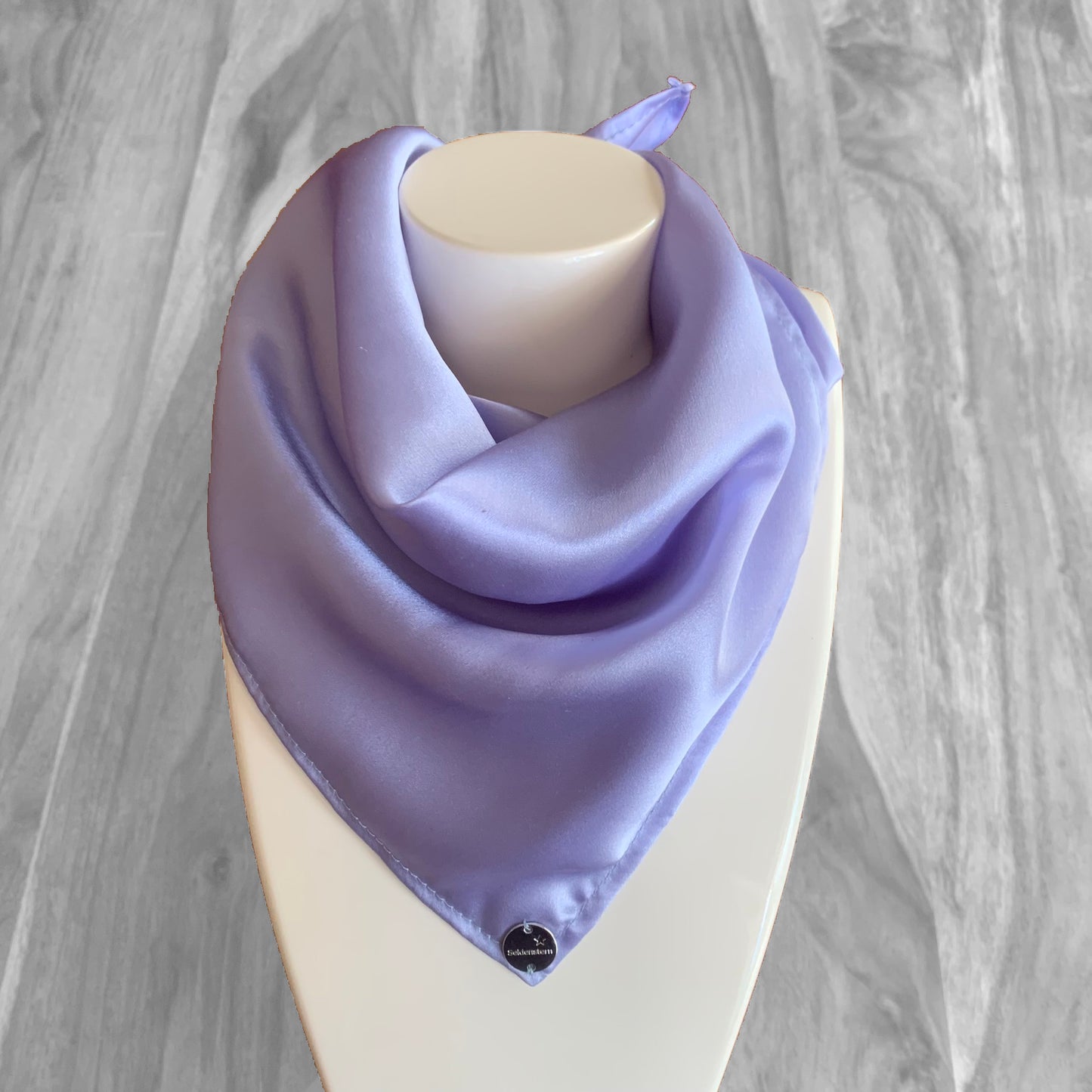 Peace Silk scarf satin lavender blue – as triangle around mannequin, glossy, marble background